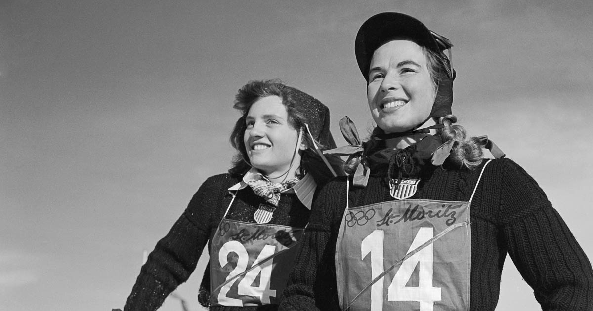 (Original Caption) Two of the U.S. team's women skiers flash winning smiles. Mrs. Gretchen Fraser (right), 28-year-old housewife from Vancouver, Washington, took first place in the women's special slalom event, becoming the first American ever to win an individual skiing championship in the history of the Olympic games. Andrea Mead (left) of Rutland, Vermont, placed eighth in the event.